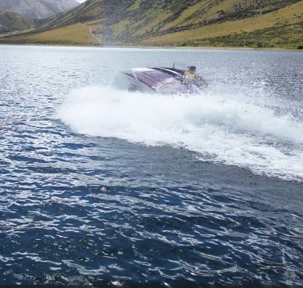 The classic boat Ruby throwing spray at speed
